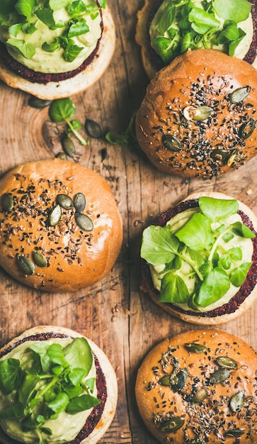 Flatlay of healthy vegan burgers with beetroot patties closeup