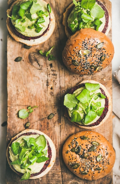 Flatlay of healthy vegan burgers with beetroot patties copy space