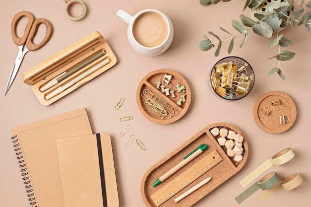 Flatlay of office supplies made of recycled materials on beige background