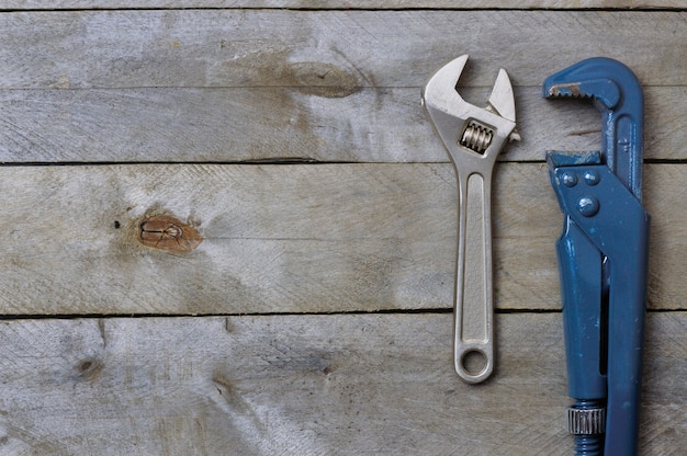 Flatlay.plumbing keys on a wooden background. copyspace