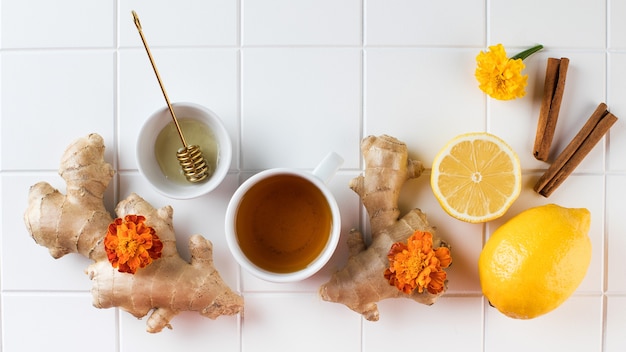 Flatlay tea lemon and ginger the concept of autumn warming tea copy space