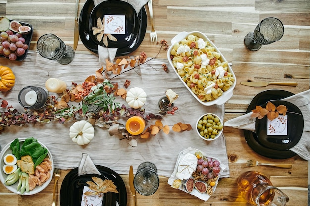 Flatlay of variety of appetizing homemade food on festive table served for celebration of family holiday