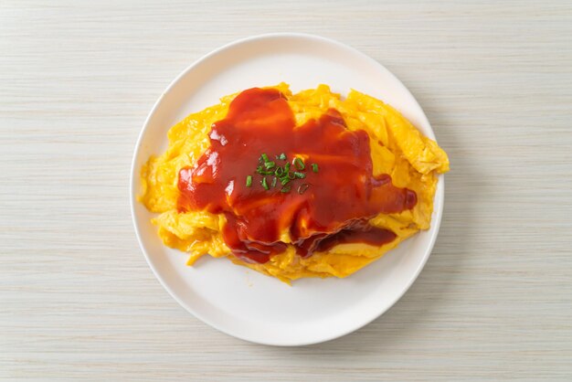 Flavored Fried Rice in an Omelet Wrapping or Omurice in Japanese style - Asian food style