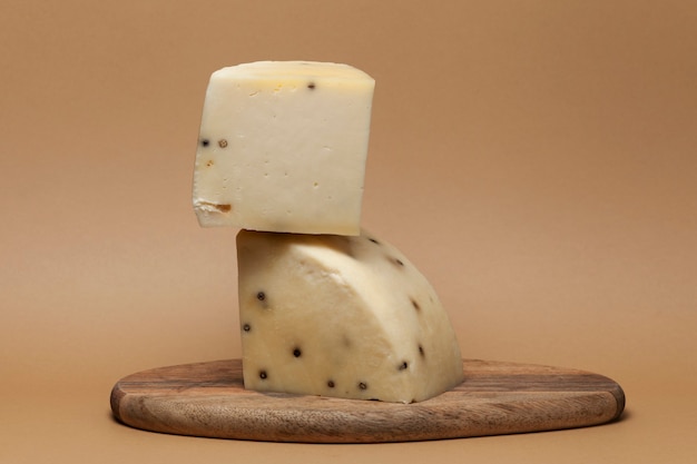 Flavored Italian Caciotta cheese with black peppercorns