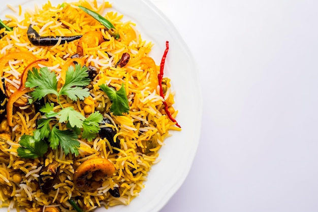 flavorful biriyani garnished with fresh minchi leaves
