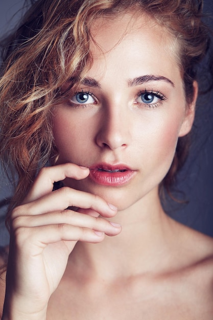 Flawless femininity Portrait of a beautiful young woman in studio