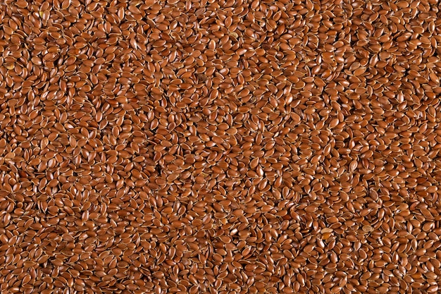 Flax grains, evenly sprinkled, brown  made of spices. , copyspace.