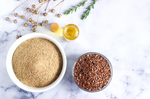 Flax seeds, flax flour, oil with sprouts and flax seed boxes