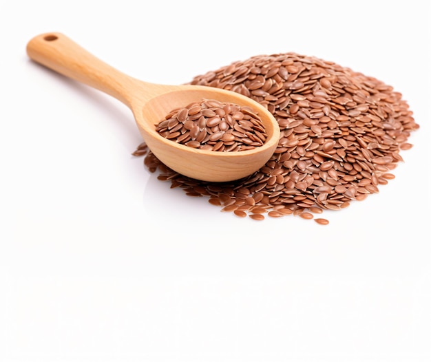 Flax seeds heap in wood spoon isolated on white background