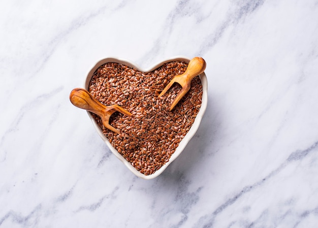 Flax seeds in heart shape bowl