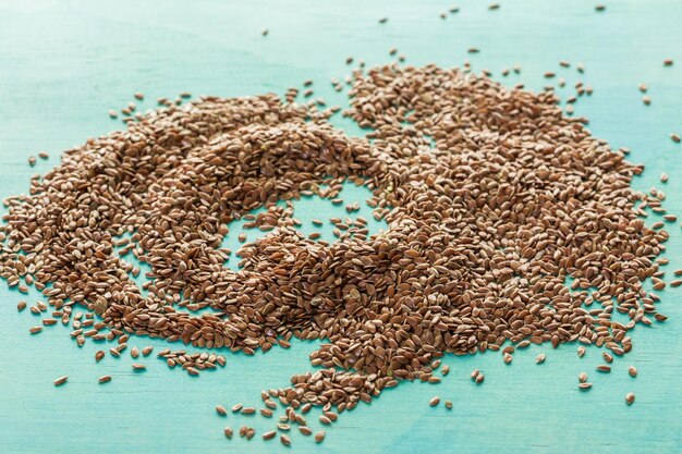 Photo flax seeds on painted wood board.