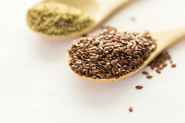 Flax seeds on painted wood board.