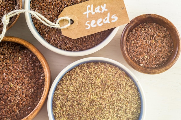 Flax seeds on painted wood board.