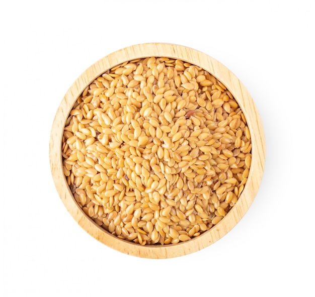 Flax seeds in wood bowl isolated