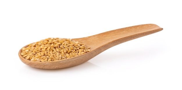 Flax seeds in wood spoon isolated