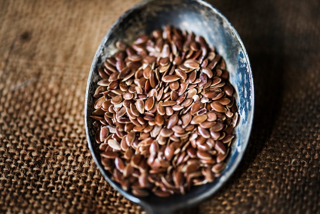 Flex seeds in spoon and sackcloth textured