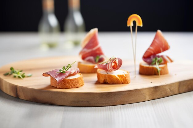 A flight of iberian ham slices next to bread rings