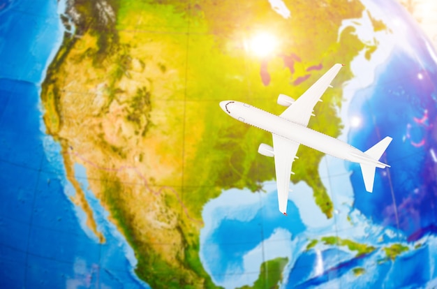 Flight to north america symbolic image of travel by plane map