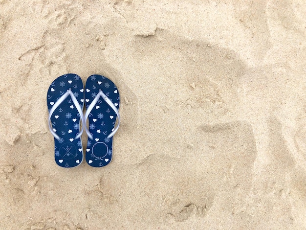 Flip flops on the beach sand