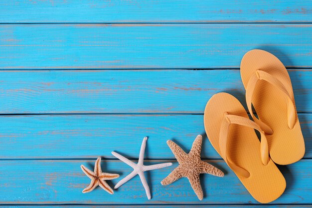 Flip flops starfish old distressed bright blue beach wood 