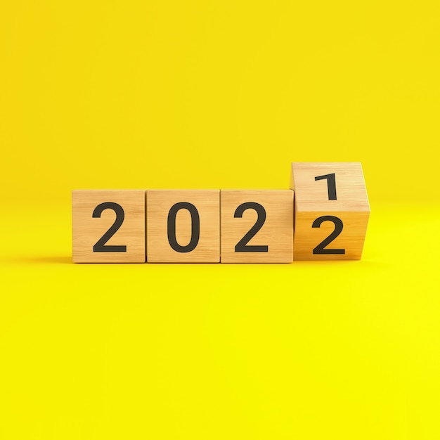 Flip over wooden cube block with new year 2022 on yellow background. 3D illustration.