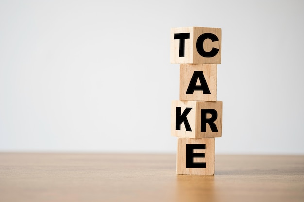 Flipping of take care yourself wording which print screen on wooden cubes blocks on table.