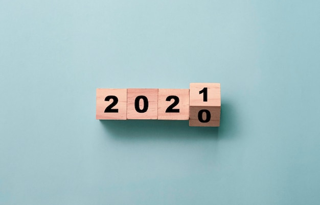 Flipping of wooden cubes block to change 2020 to 2021