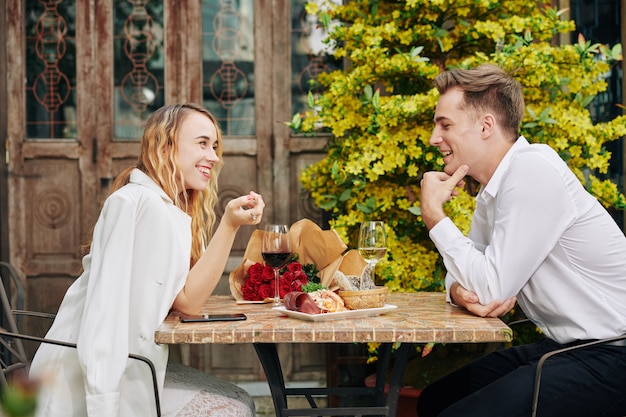 Flirting couple at restaurant