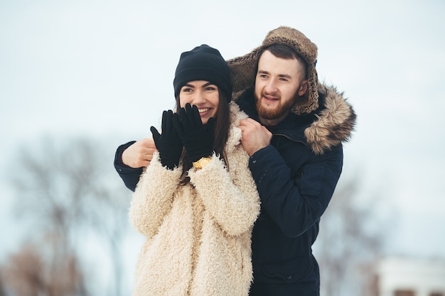 flirting woman blows snowballs youth