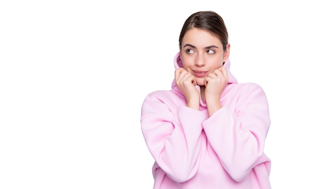 Flirty young woman in pink hoodie isolated on white background