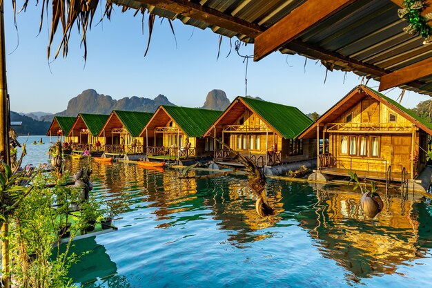 Floating bangalows wait for tourists to arrive at Cheow Lan Dam or Ratchaprapa Dam in Surat Thani province Thailand