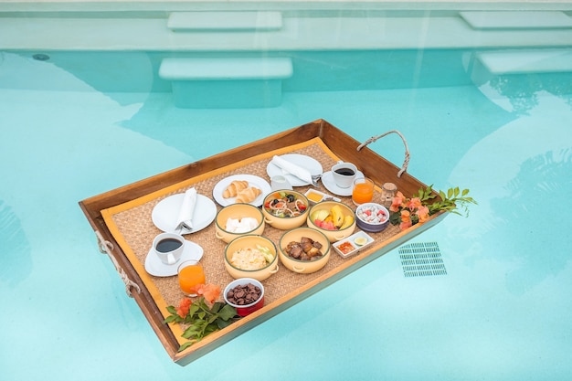 floating breakfast tray in luxury pool hotel