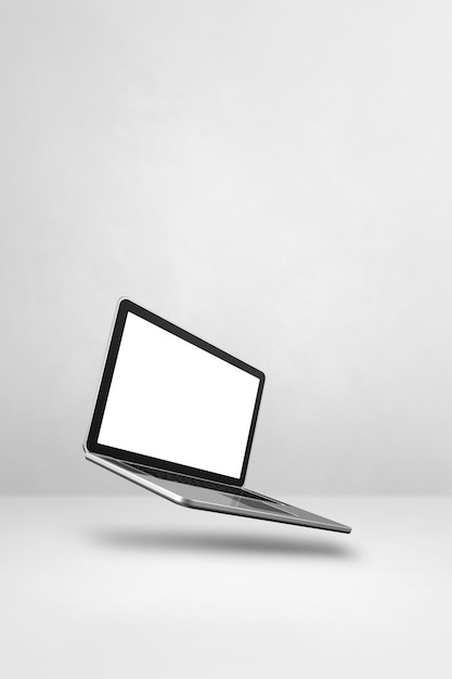 Floating computer laptop isolated on white Vertical background