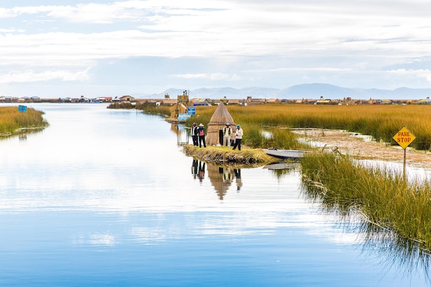 Floating Islands on Lake TiticacaSouth America located on border of Peru and Bolivia It sits 3812 m above sea level making it one of commercially navigable lakes in world