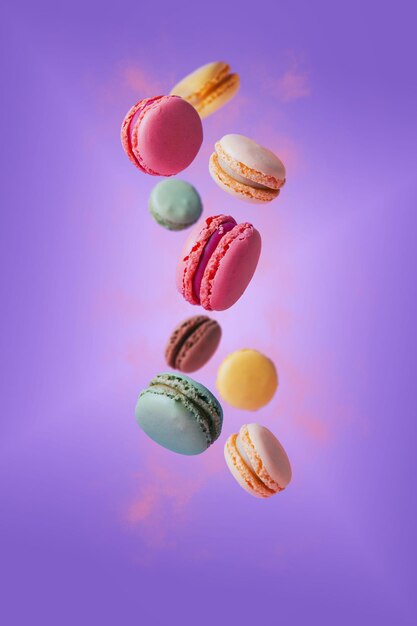 Floating macarons dessert on pastel tones background Copy space