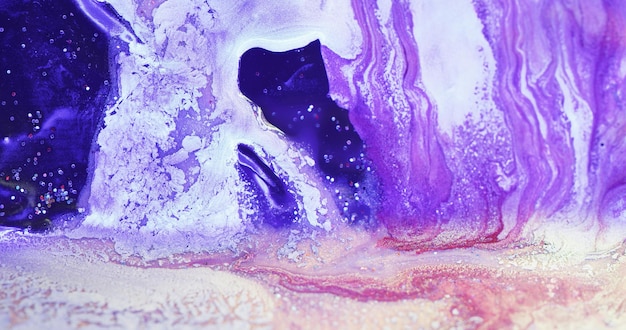 Floating paint Acrylic ink mix Fantasy waterfall Defocused neon purple blue pink white color glitter fluid spill abstract art background