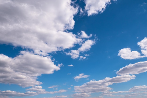 Floating white clouds in the blue sky