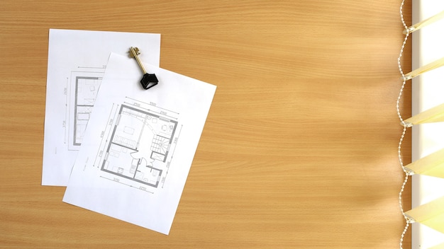 Floor plan of house is located on the table