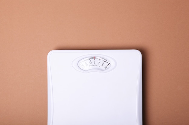 Photo floor scales on a colored background top view