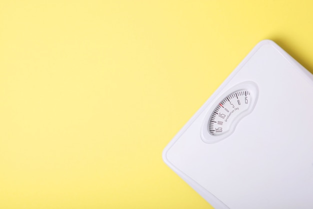 Floor scales on a colored background top view