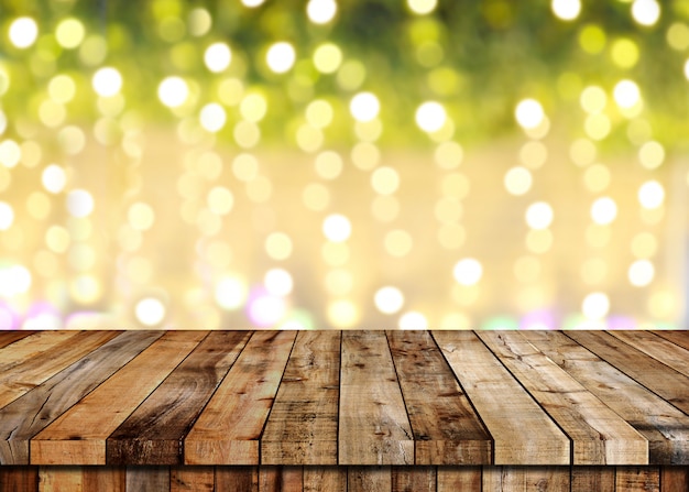 Floor of wooden table and Christmas bokeh background.