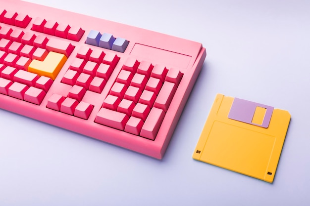 Floppy disks and keyboard on bright colored backgrounds