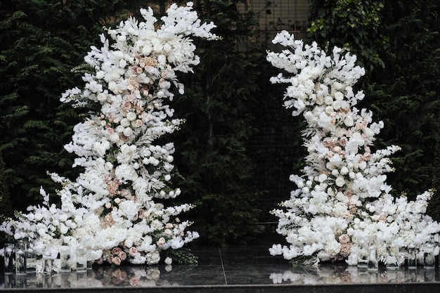 A floral arch with white flowers