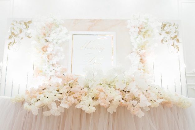 Floral arrangement on the Banquet table of the bride and groom at the wedding