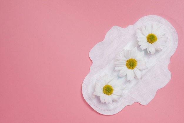 Floral clean sanitary pad, hygiene concept, women products, menstrual pads.