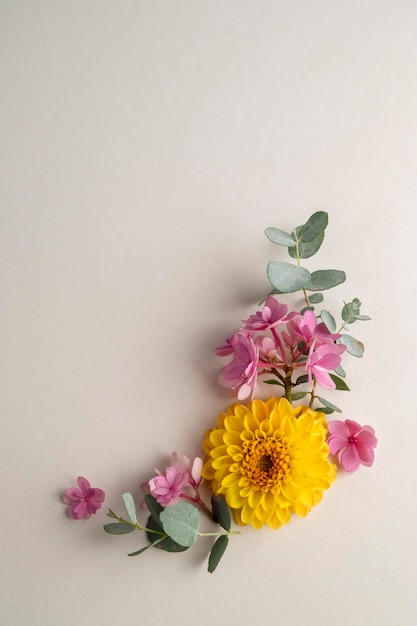 Floral composition greeting card mockup Pink and yellow flowers with copy space Hydrangea dahlias and eucalyptus
