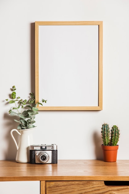 Floral composition with frame and camera