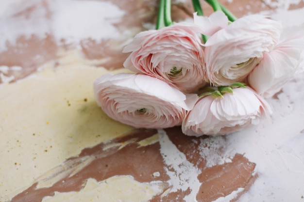 Floral decoration surface with pink ranunculus