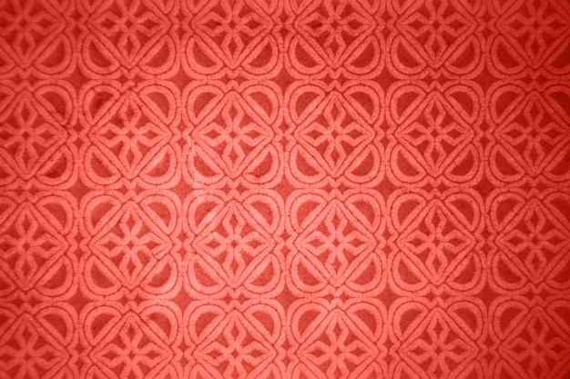 Floral decorative pattern from glazed ceramic tile in a trendy color living coral