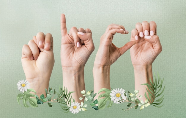 Foto mani floreali che usano il linguaggio dei segni